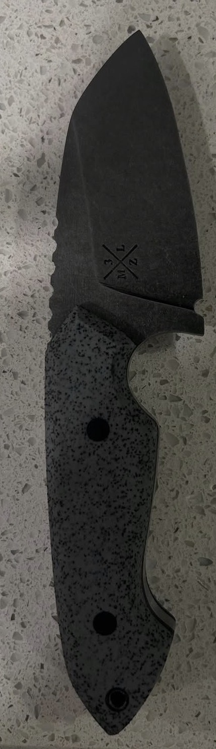 Knife with speckled dark handle